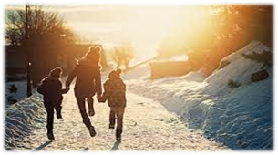 A group of people walking on a snowy roadDescription automatically generated with medium confidence