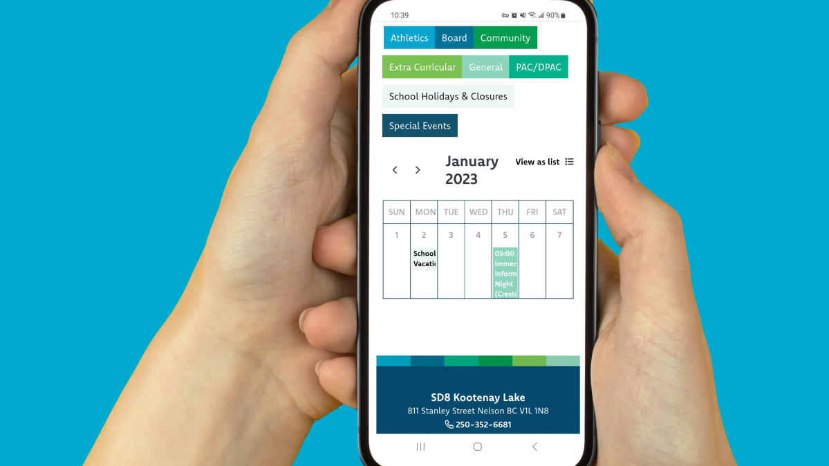 Hands cradling smartphone with school calendar showing on screen against sky blue background