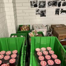 Jars of purple jam in green crates