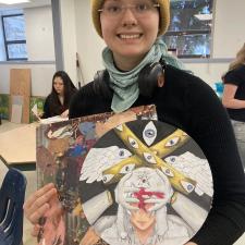 Trafalgar Middle School art student holding artwork