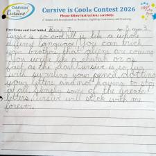 A lined paper with student cursive writing filling part of the page